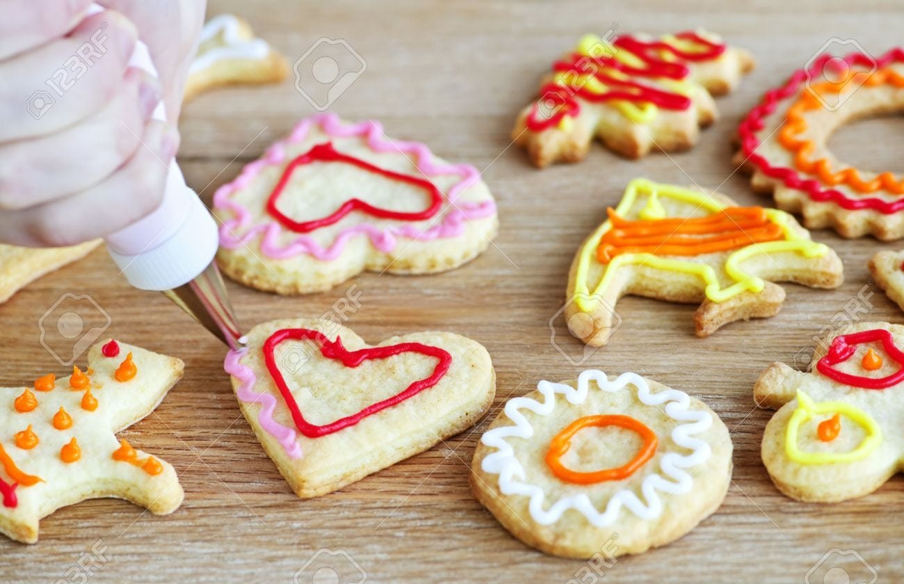 Decorating Homemade Shortbread Cookies With Icing From Piping