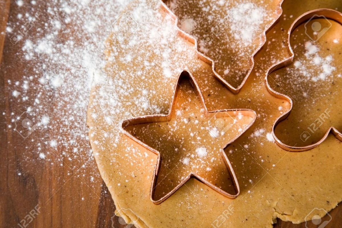 Baking Christmas Cookies With Star And Tree Motif Stock Photo