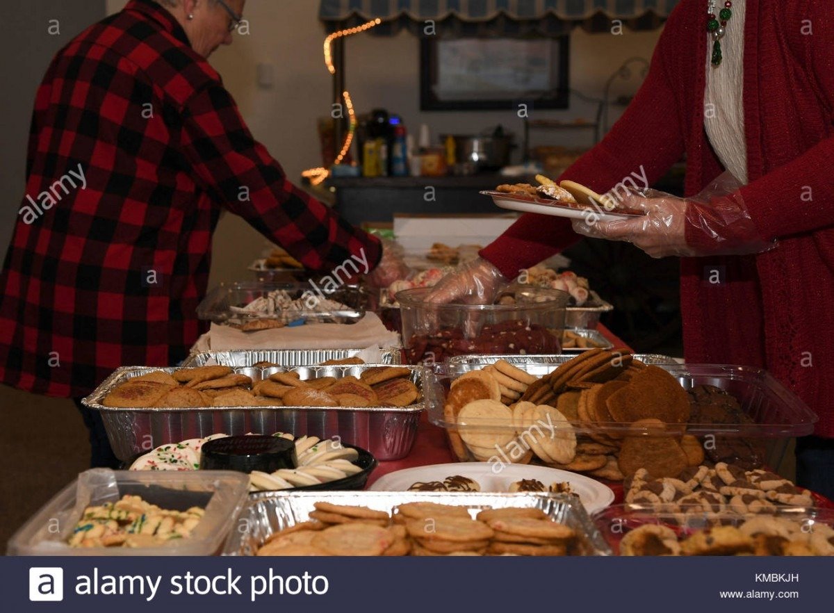 Members Of The Spouses Club On Base Plate Cookies At The Annual