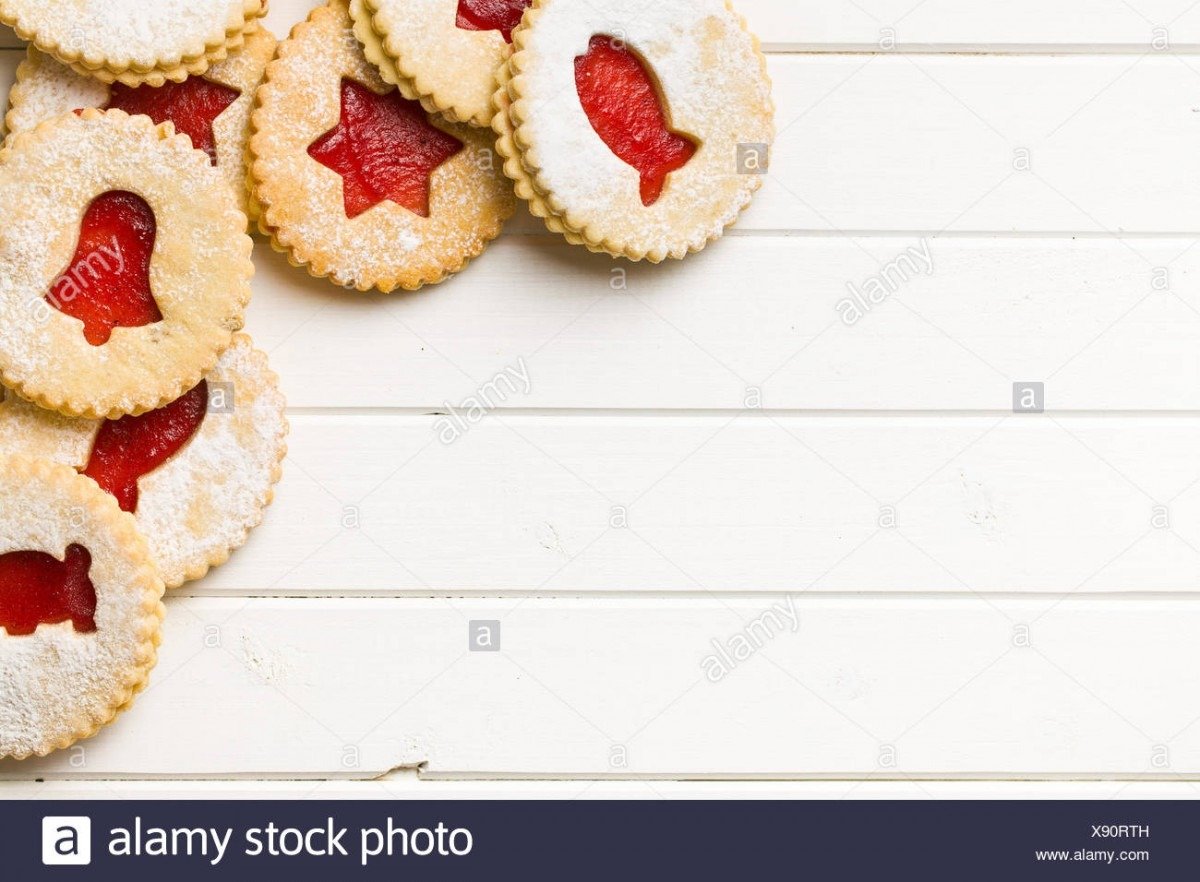 Top View Of Jelly Christmas Cookies On White Wooden Table Stock