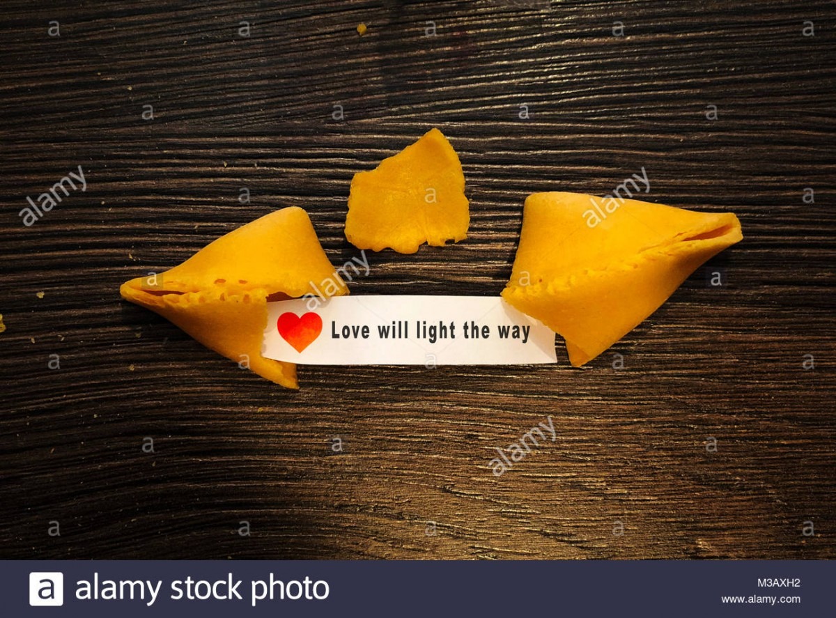 Love Will Light The Way Fortune Cookie Message On Wooden